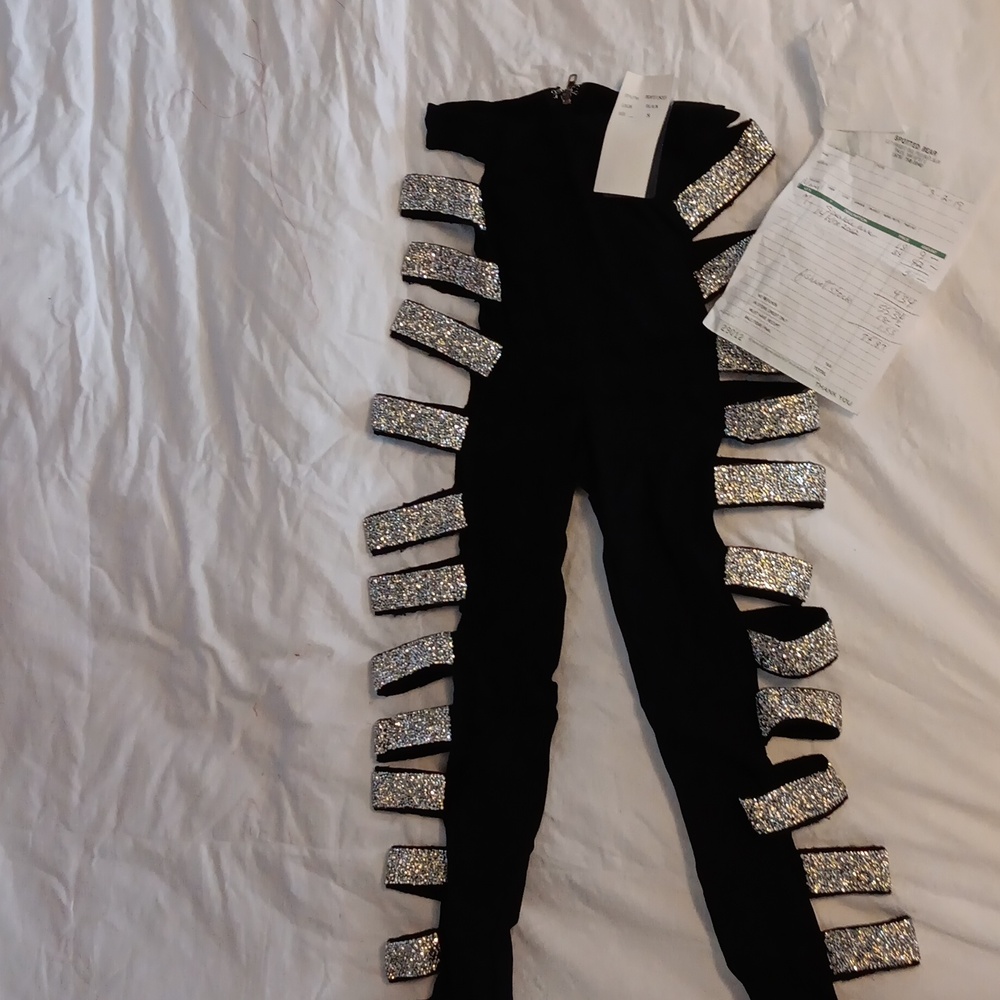 Black performing leggings with side sequence and zipper in the back.